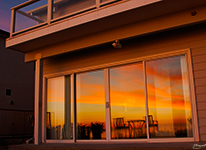 Sunset reflected in the downstairs windows