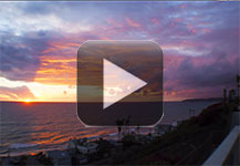 Time-lapsed video of a sunset with cloud reflections